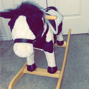 Real Wood Ride-On Plush Rocker. Black and White with Real Metal Stirrups.